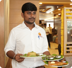 Staff serving food at Paakashala restaurant