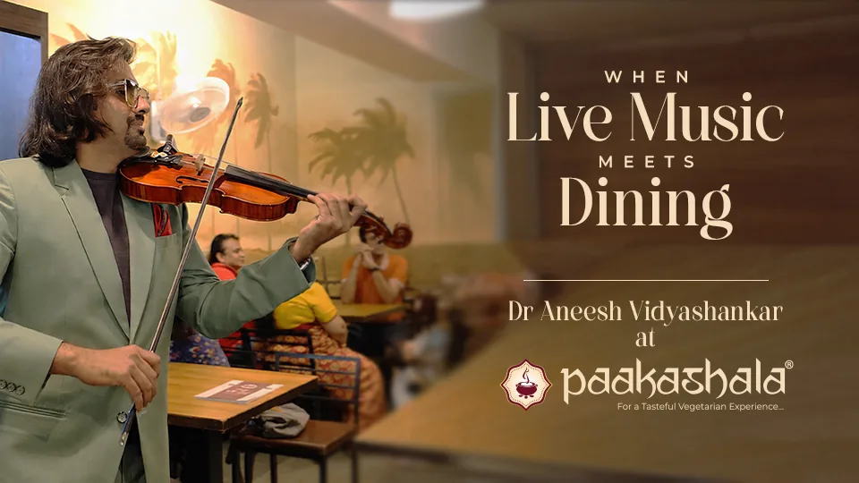 Dr Aneesh Vidyashankar playing the violin at a Paakashala outlet